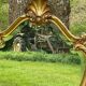 Beveled gilded wood mirror with violin shapes, Louis XV baroque style shell