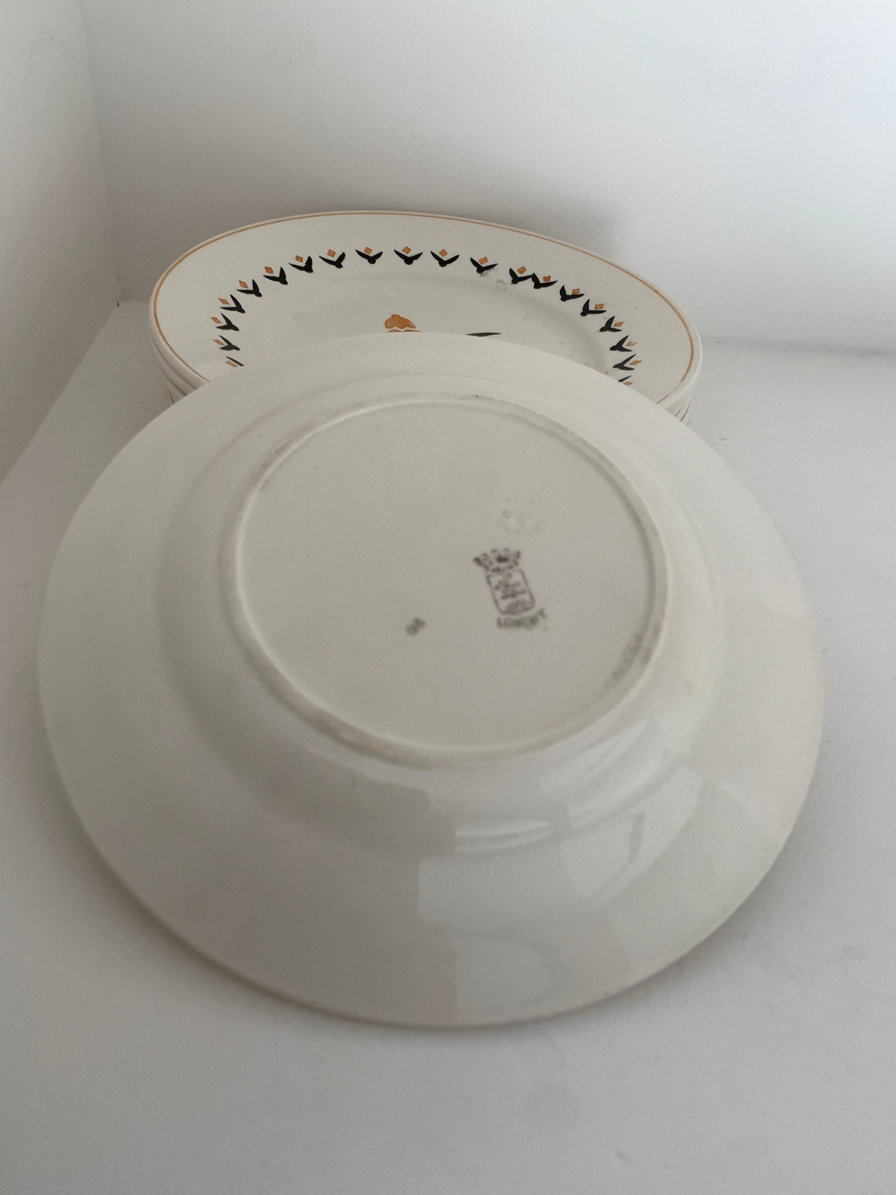 7 dessert plates and one Longwy dish