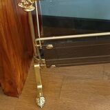 porte revues en bronze et verre teinté 1950 à pieds griffés