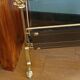 1950s bronze and tinted glass magazine rack with clawed feet