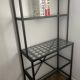 Black metal designer shelf with glass shelves