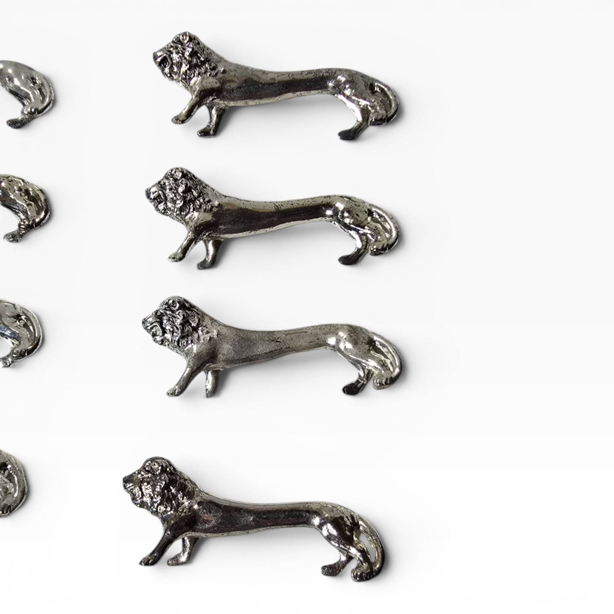 Series of antique knife rests in the shape of a lion, silver-plated metal.