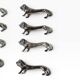 Series of antique knife rests in the shape of a lion, silver-plated metal.