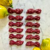 12 porte-couteaux "Dog" en céramique bordeaux - 1950.