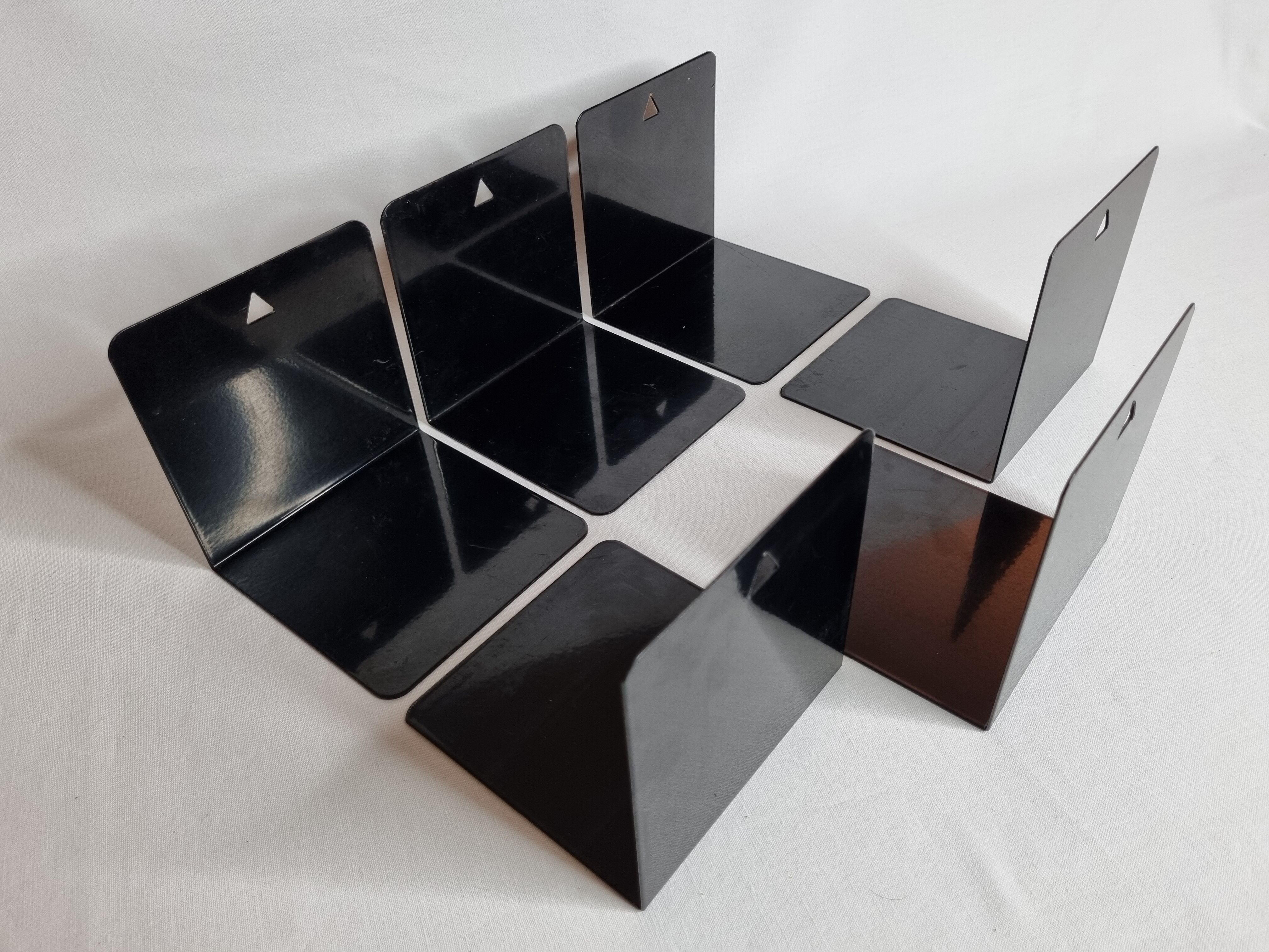 Set of six vintage black lacquered steel bookhouses