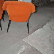 Pair of Mid-Century armchairs in black metal and orange fabric, VEB Sitzmöbelwerke, 1960s.