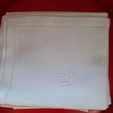 Set of 6 white damask hemmed napkins with handmade stitching and monogram.