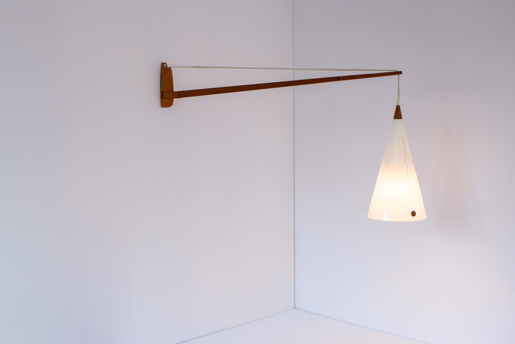 Mid-century Swedish wall lamp in teak by Uno and Östen Kristiansson for Luxus, 1960s