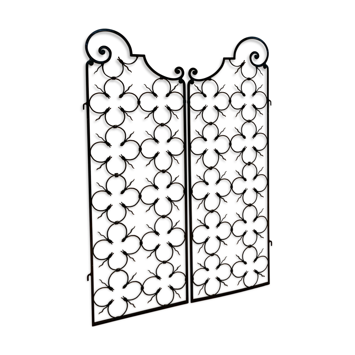 Ancient pair of door opening gates has hell volutes forged craftsmanship