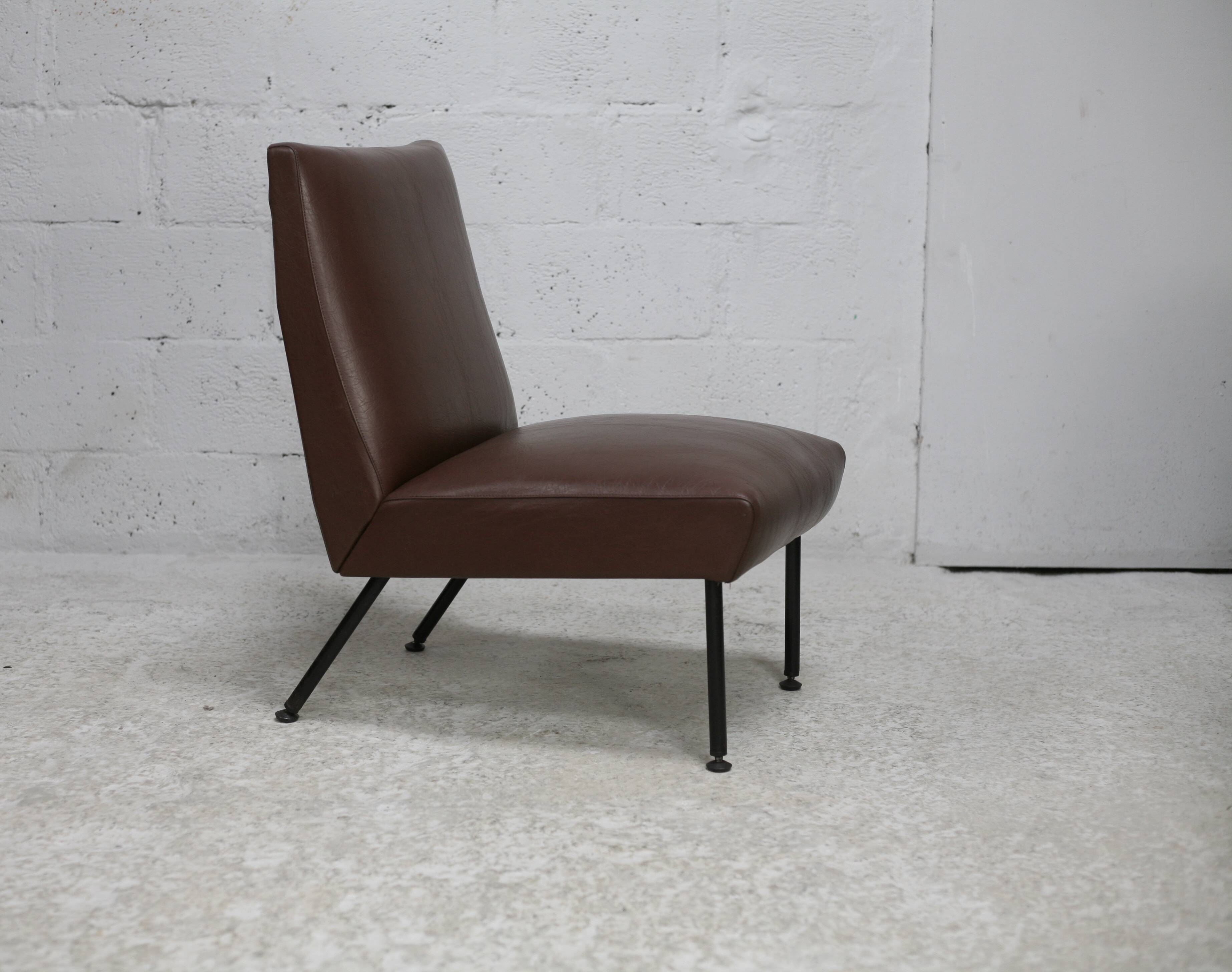 Low chair, circa 1950. Brown imitation leather.