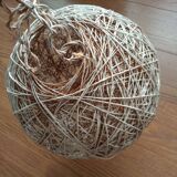 Globe suspension made of twine and wicker