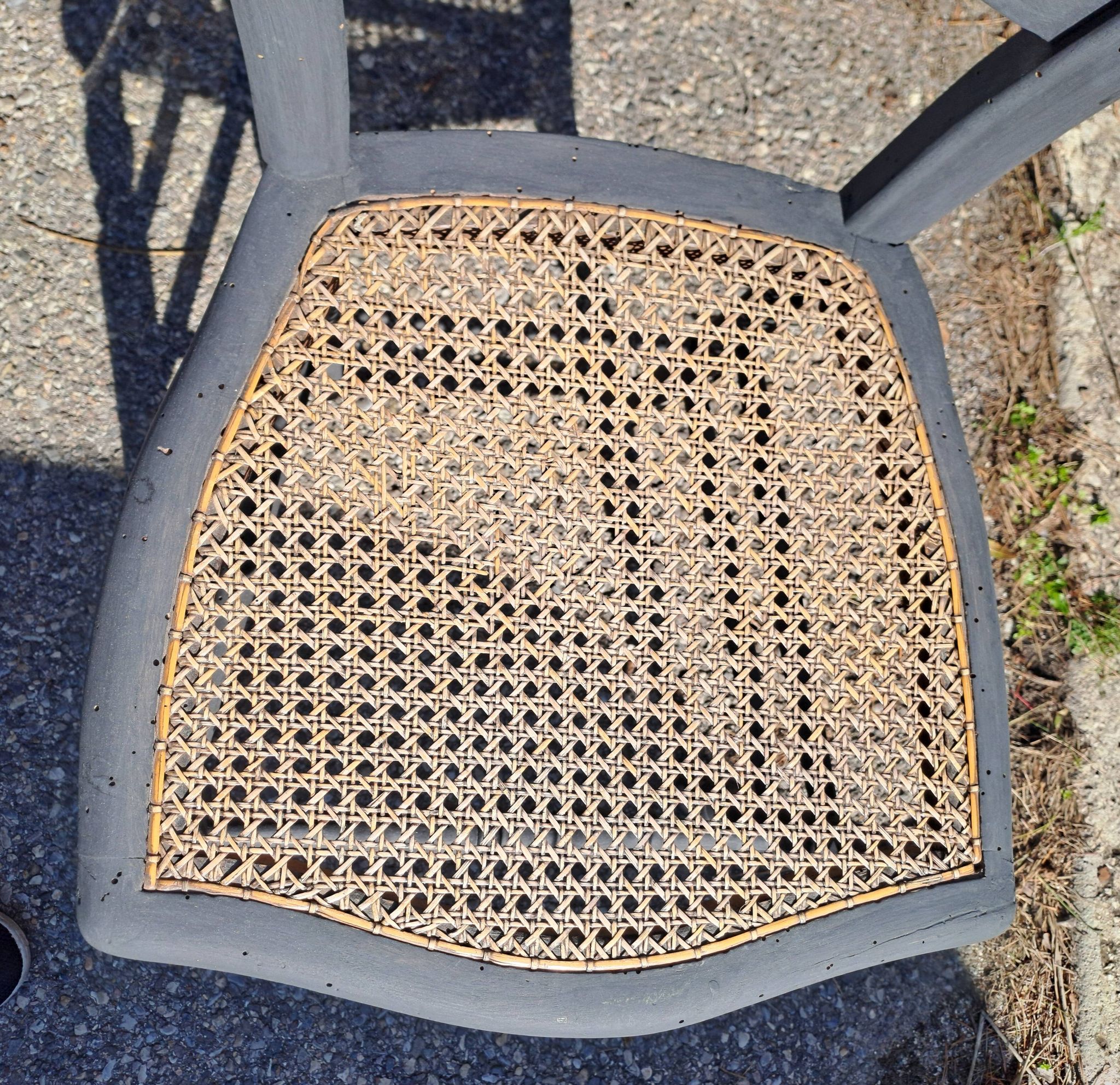 Pair of 2 chairs with cane seats in black wood, circa 1940