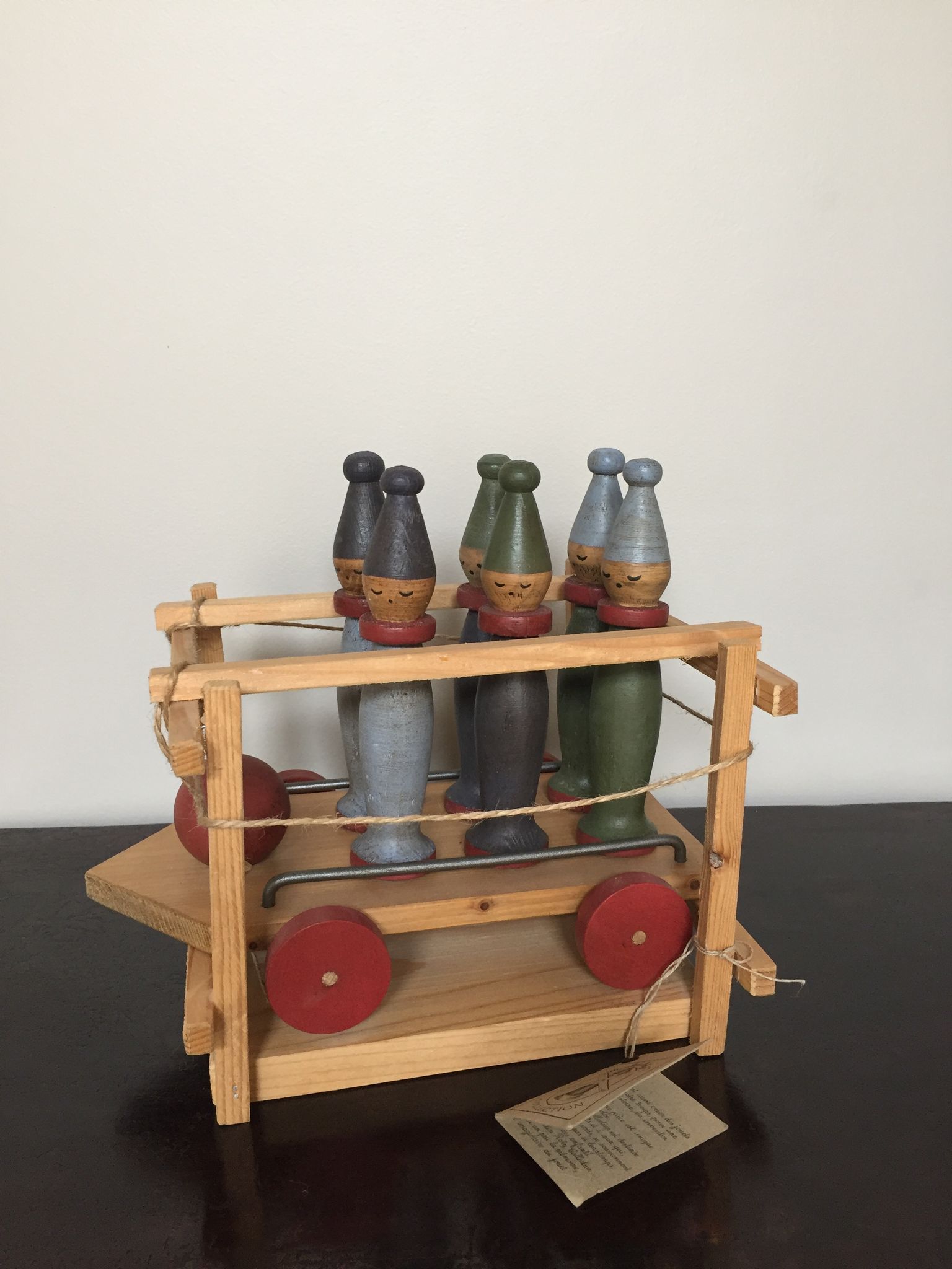 Set of Moulin Roty brand wooden bowling on roller cart, limited series.