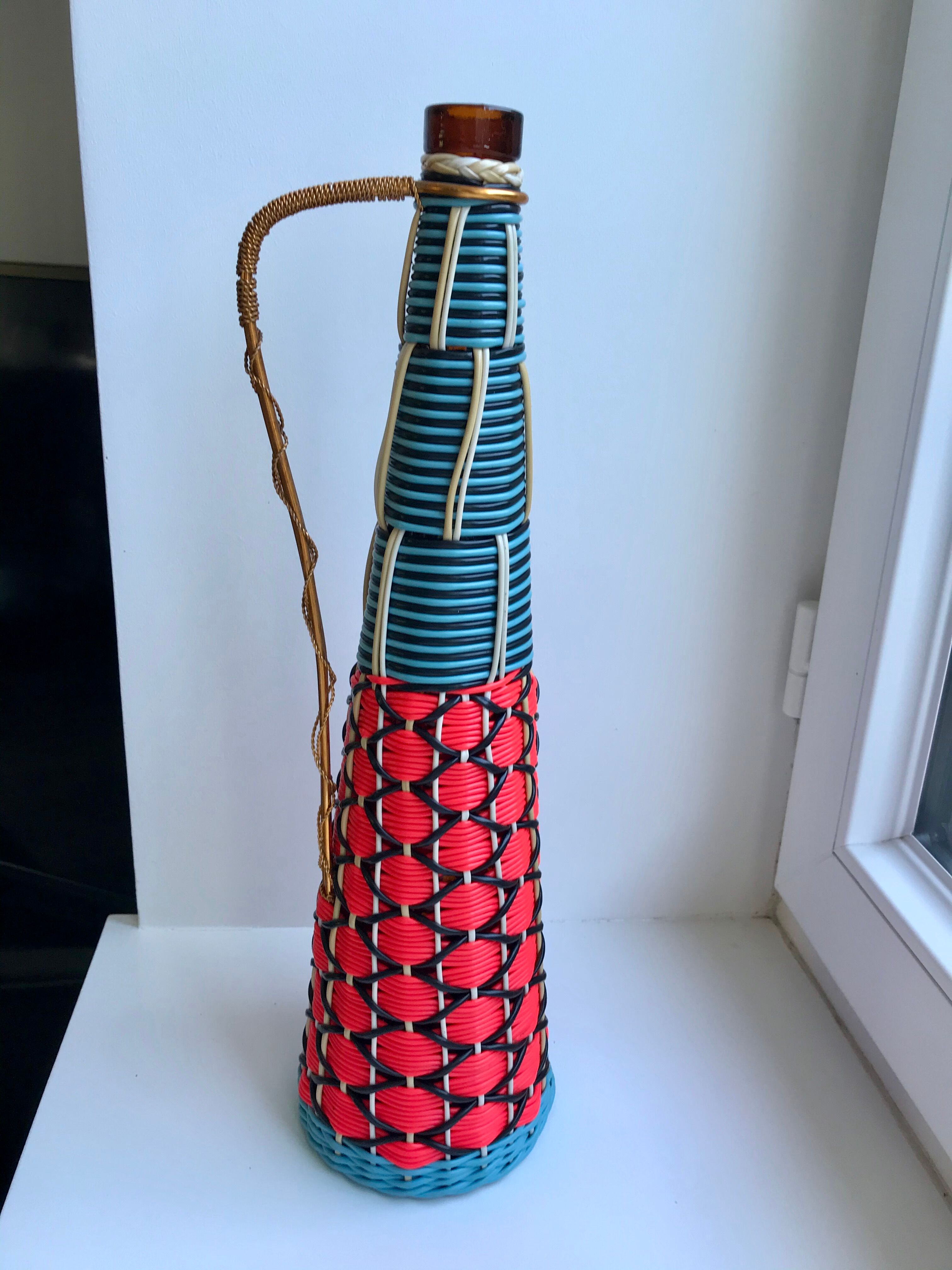 Scoubidou bottle with orange and blue and yellow brass handle 70s