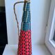 Scoubidou bottle with orange and blue and yellow brass handle 70s