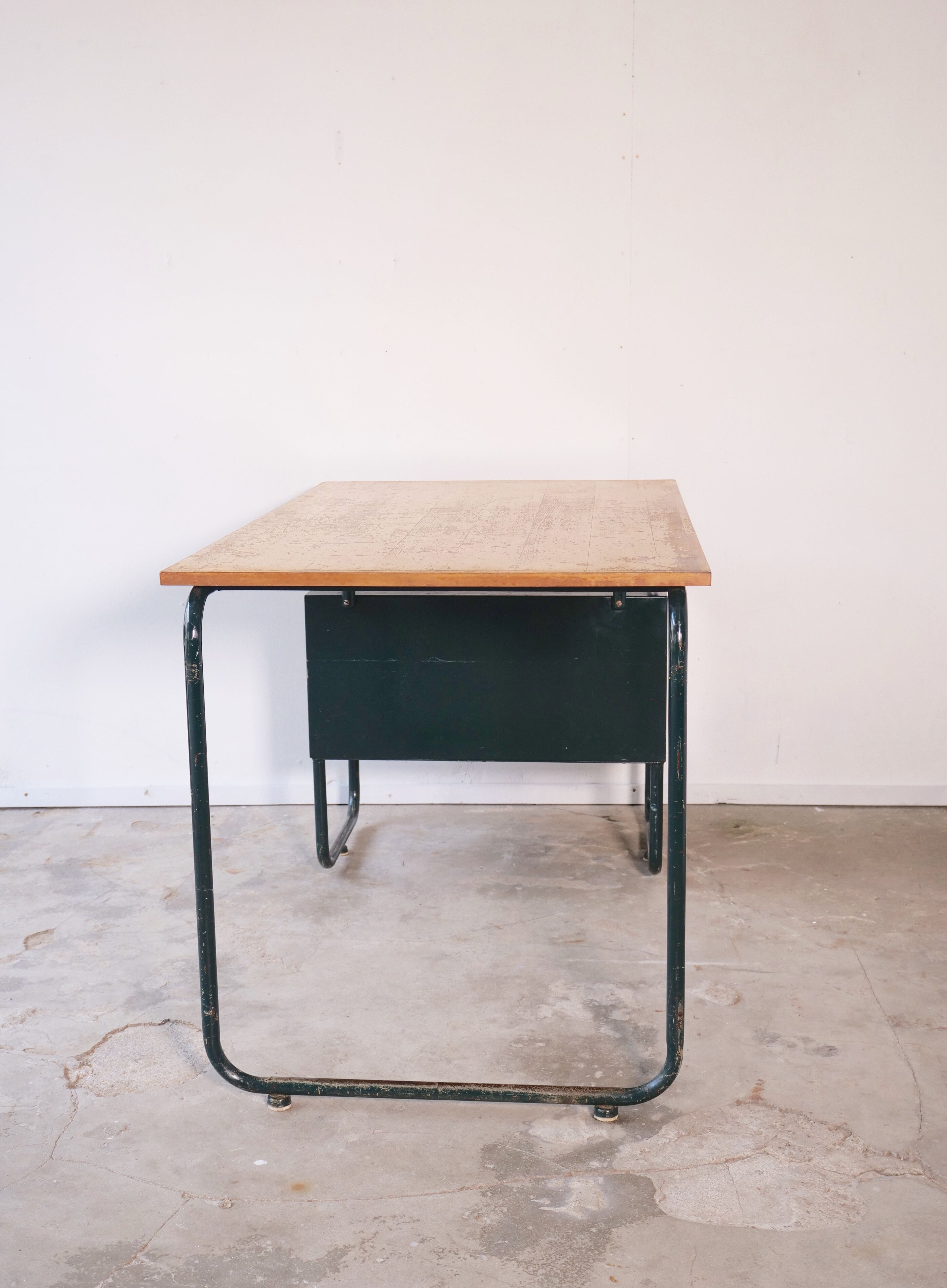 Desk with bauhaus style tubular steel chair