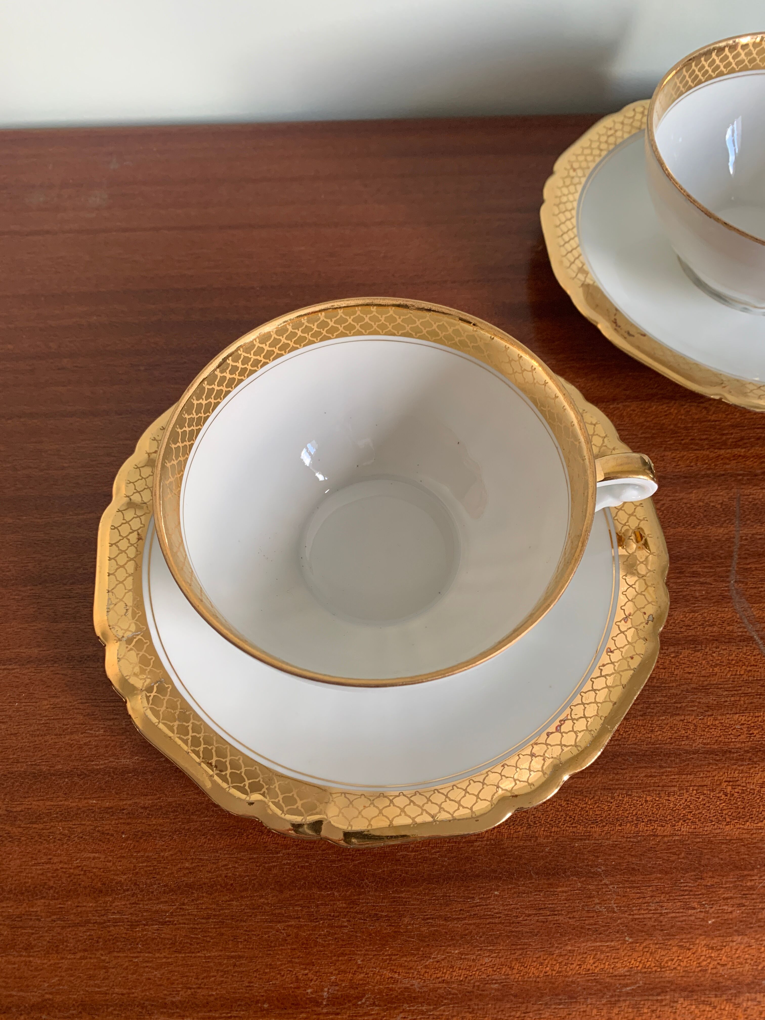Pair of gold porcelain tea cups