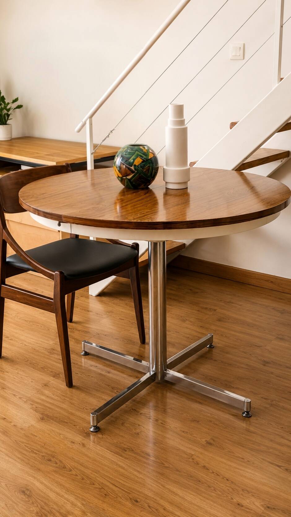 Extendable round table with a space age vintage mid-century formica top.