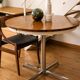 Extendable round table with a space age vintage mid-century formica top.