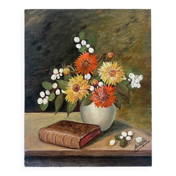 Still life with flowers and a book.