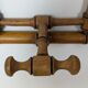 Wall-mounted coat rack made of turned wood
