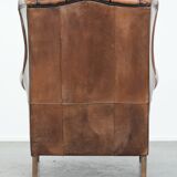 Sheepskin wingback armchair with beautiful colours in good condition