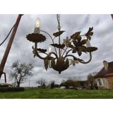 Vintage gold metal chandelier with floral decoration.