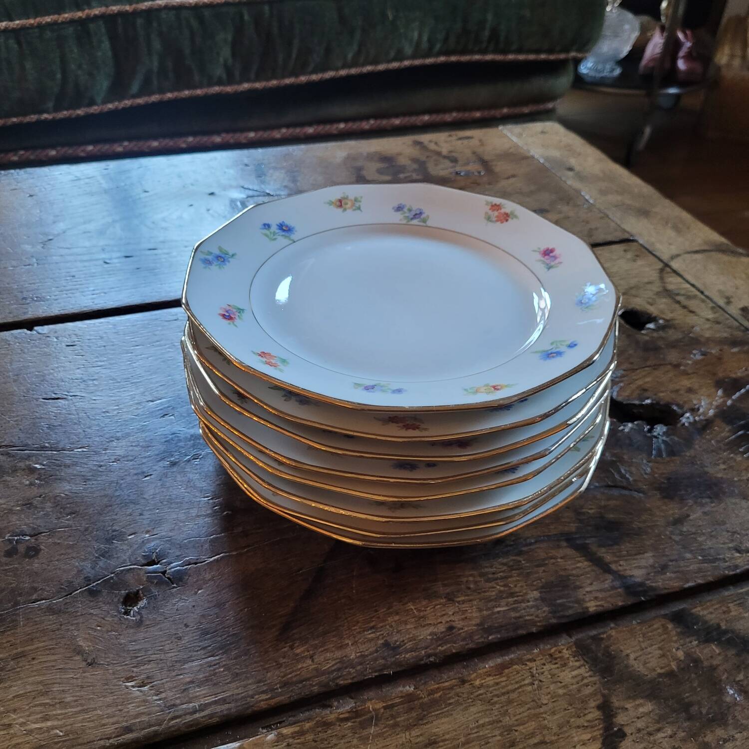 8 porcelain dessert plates with gold rim and various flowers