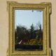 Antique mercury mirror in the Napoleon III style.