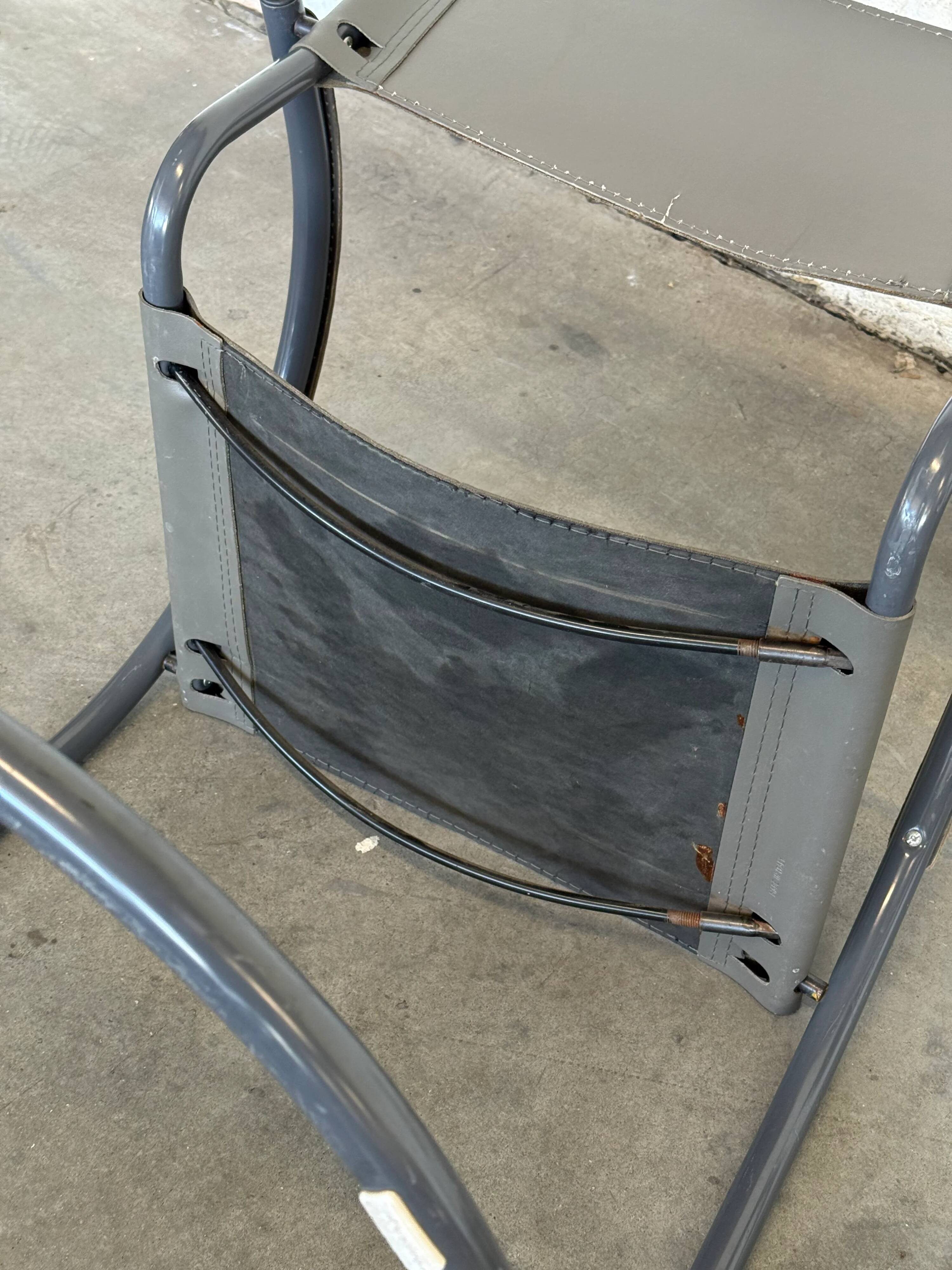 Vintage cantilever lounge chairs — pair, grey leather and tubular steel
