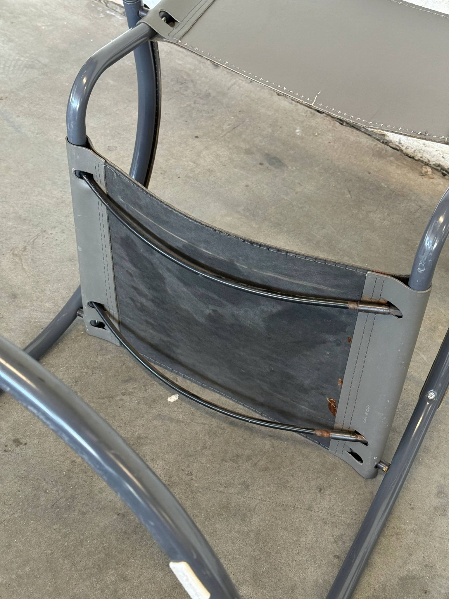 Vintage cantilever lounge chairs — pair, grey leather and tubular steel