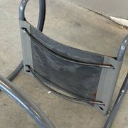 Vintage cantilever lounge chairs — pair, grey leather and tubular steel