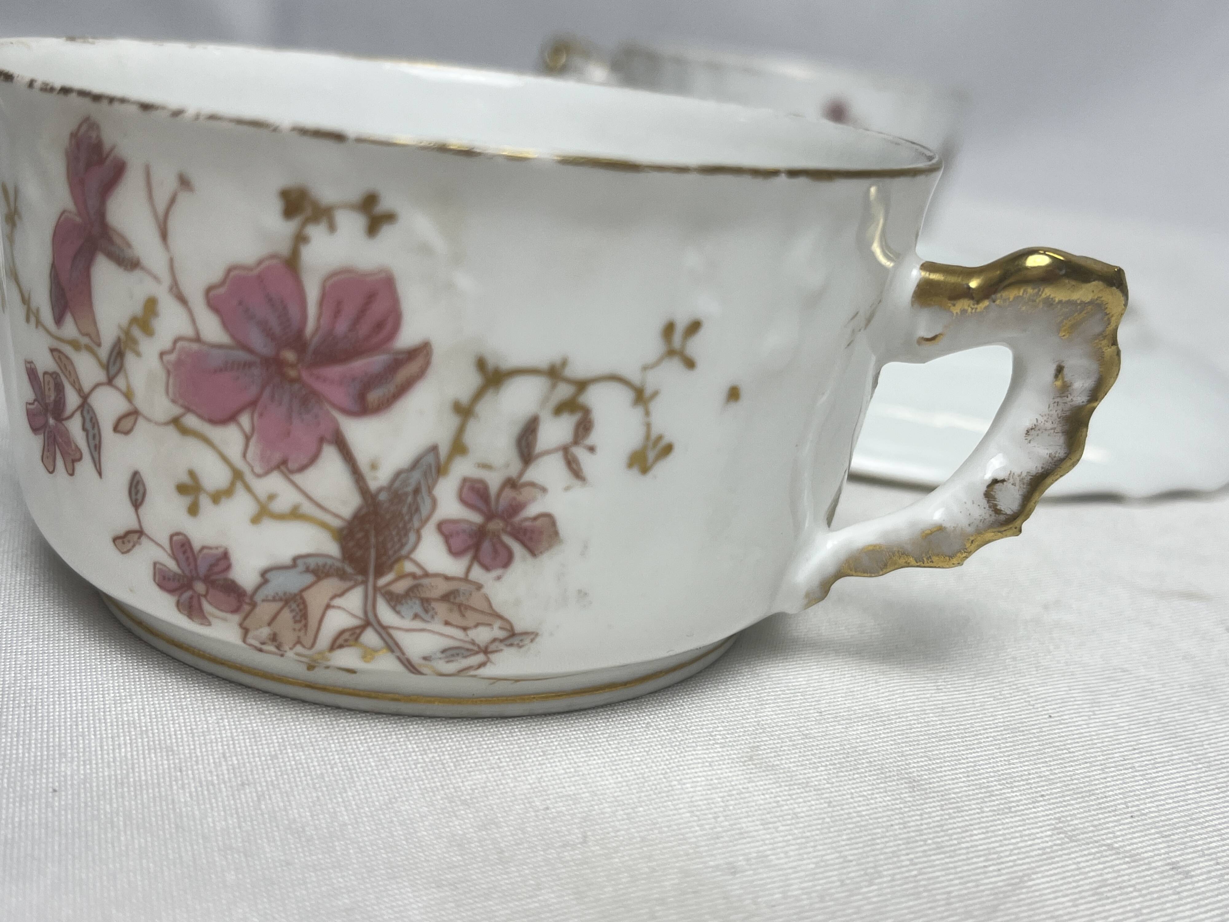 Two English porcelain teacups with floral decoration, 19th century