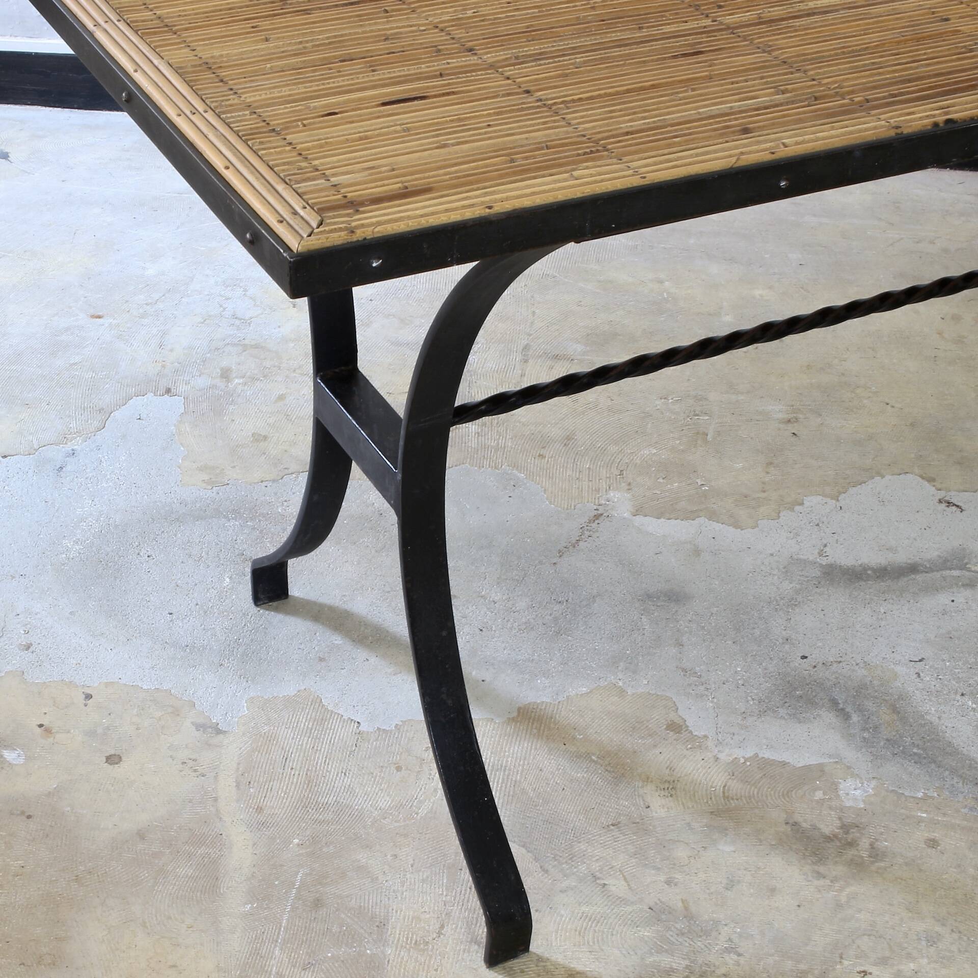 Dining table in rattan and wrought iron similar to Audoux & Minet.