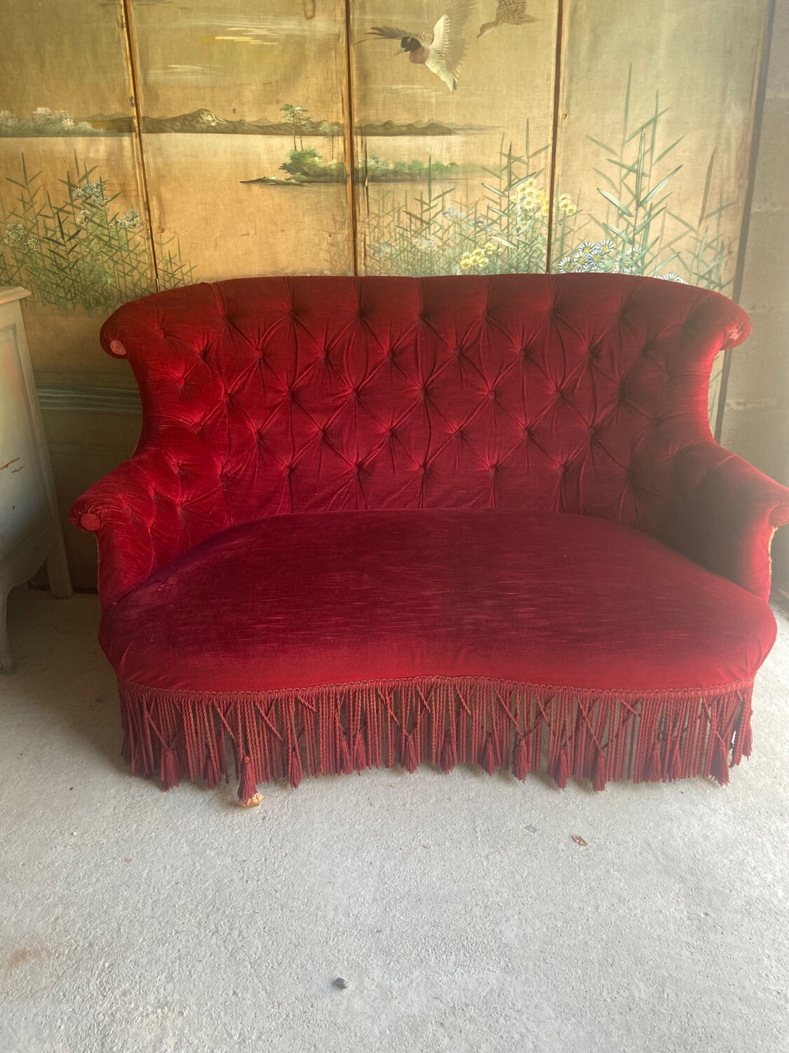 Small old Napoleon III toad sofa in red velvet