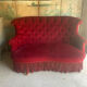 Small old Napoleon III toad sofa in red velvet