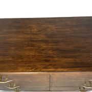 A vintage Italian chest of drawers, made of veneered walnut and solid wood,