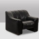 Maison De Sede. Armchair and its ottoman in black leather. 1970s.