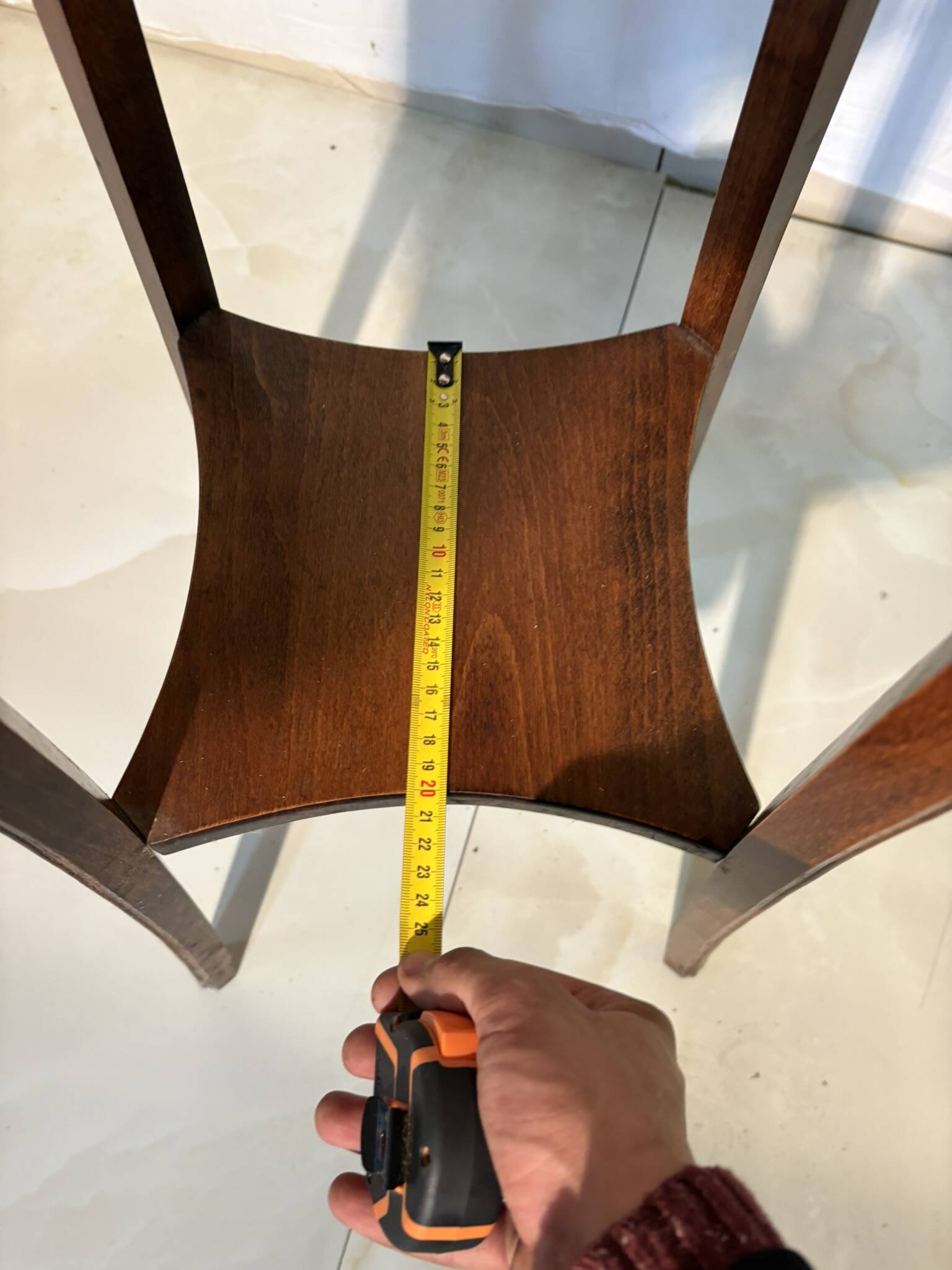 Vintage dark wood side table with curved base