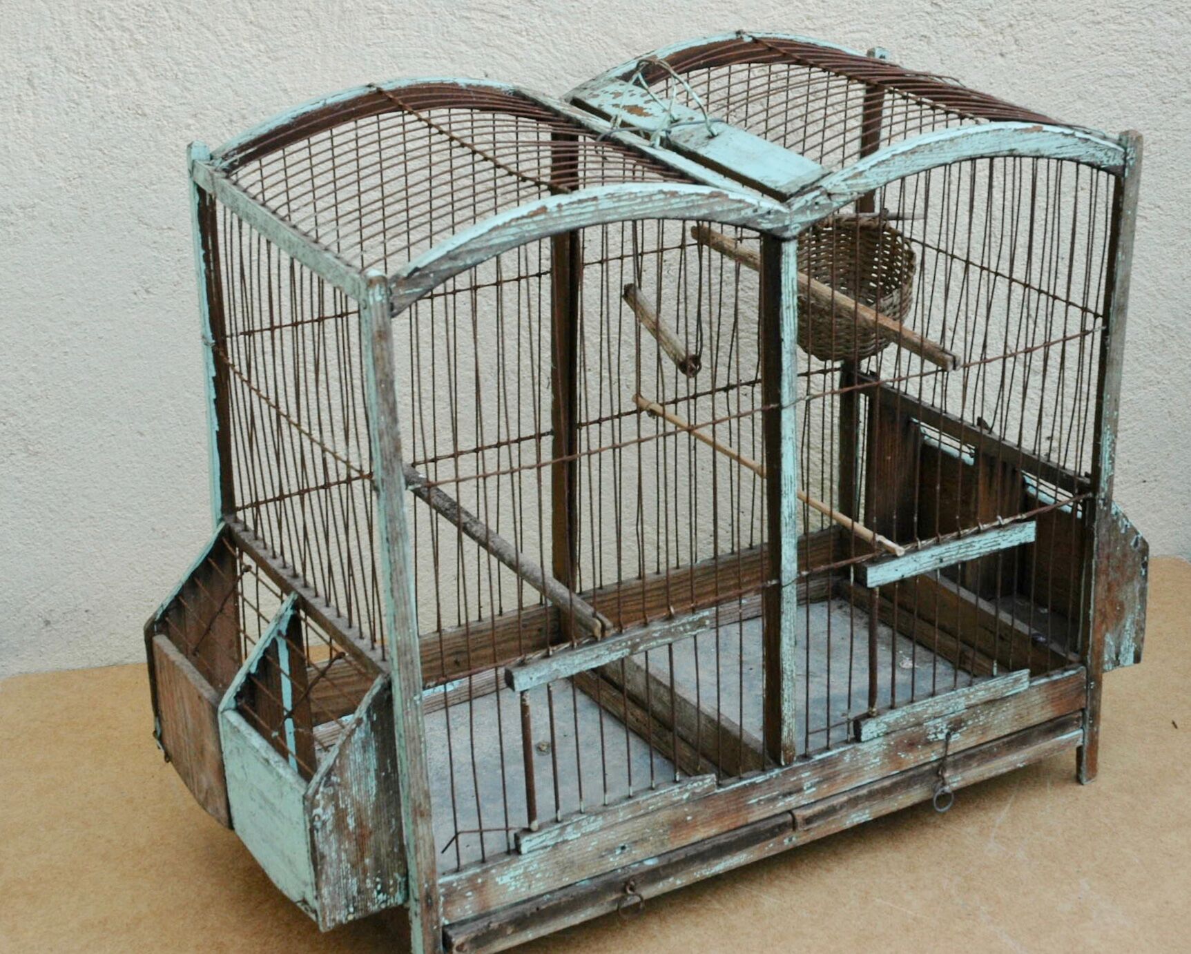 Ancient bird cage in wood and metal