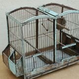 Ancient bird cage in wood and metal