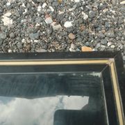 Vintage metal coffee table with glass top.