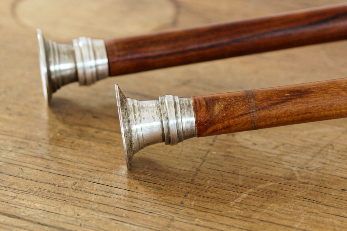 Pair of Indian candle holders, wood and silver metal