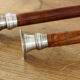 Pair of Indian candle holders, wood and silver metal