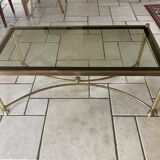 Coffee table in glass and gold metal