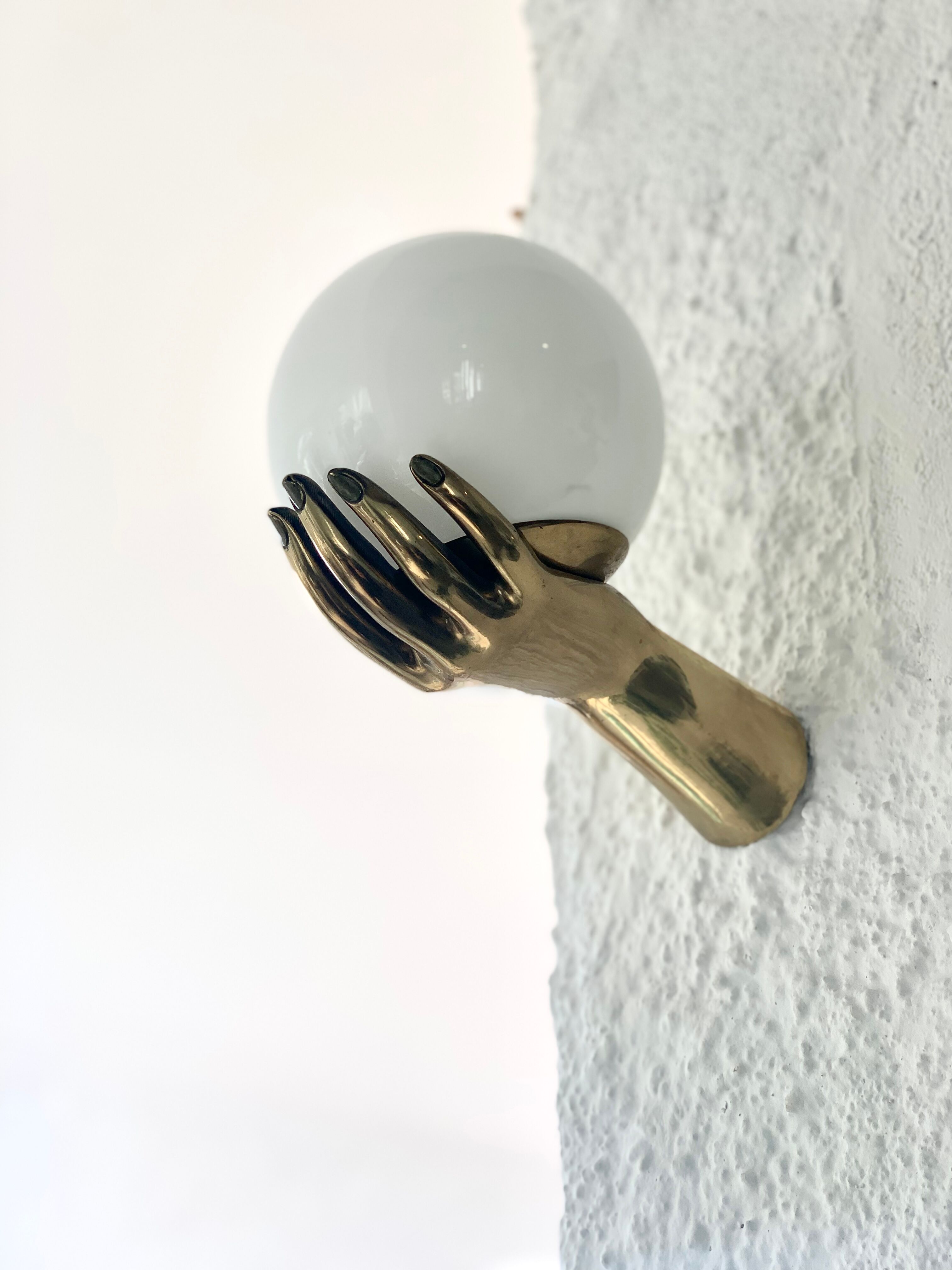 Pair of brass "hands" wall lamps, Arlus 1960