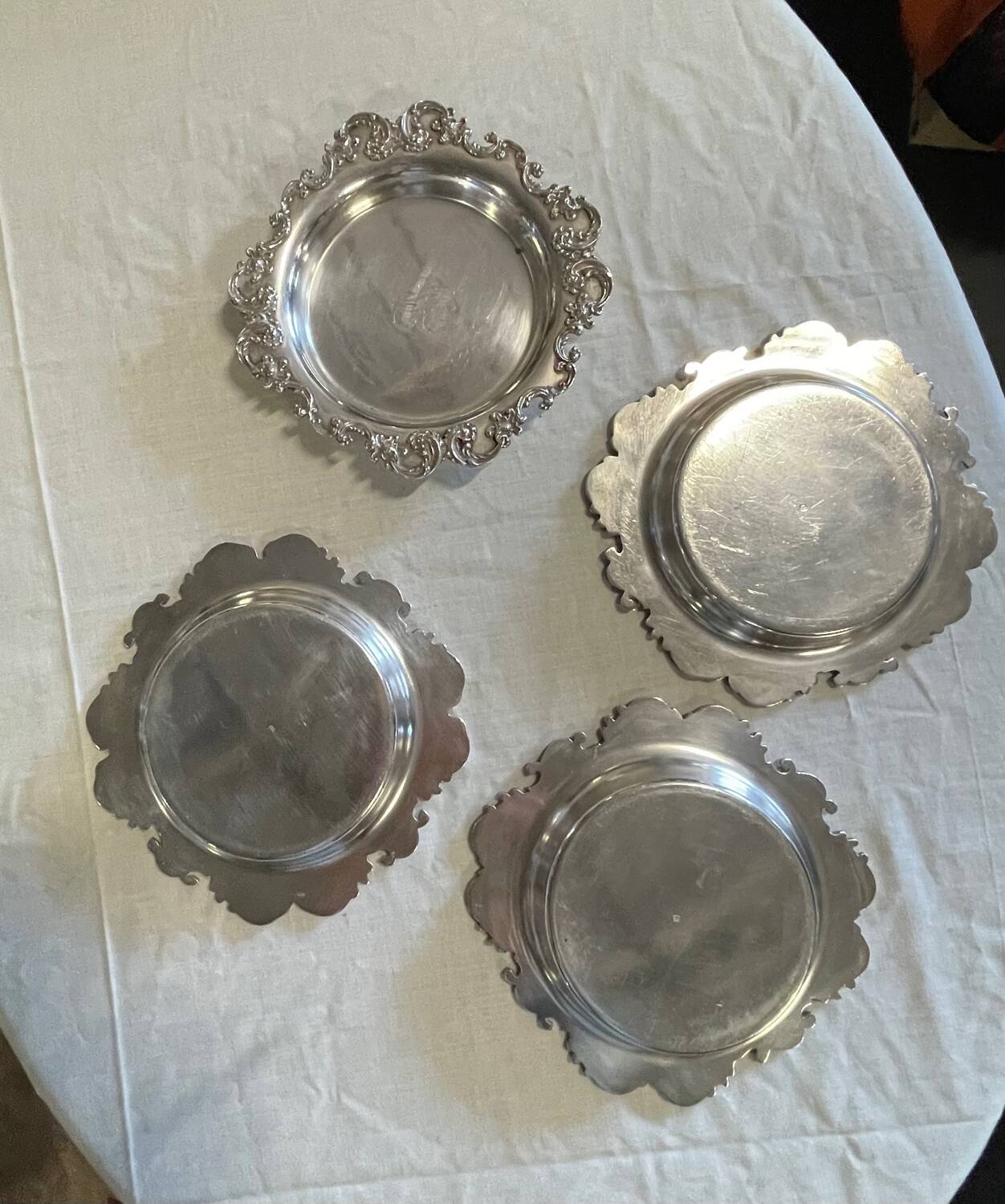 Set of 4 silver metal bottle coasters