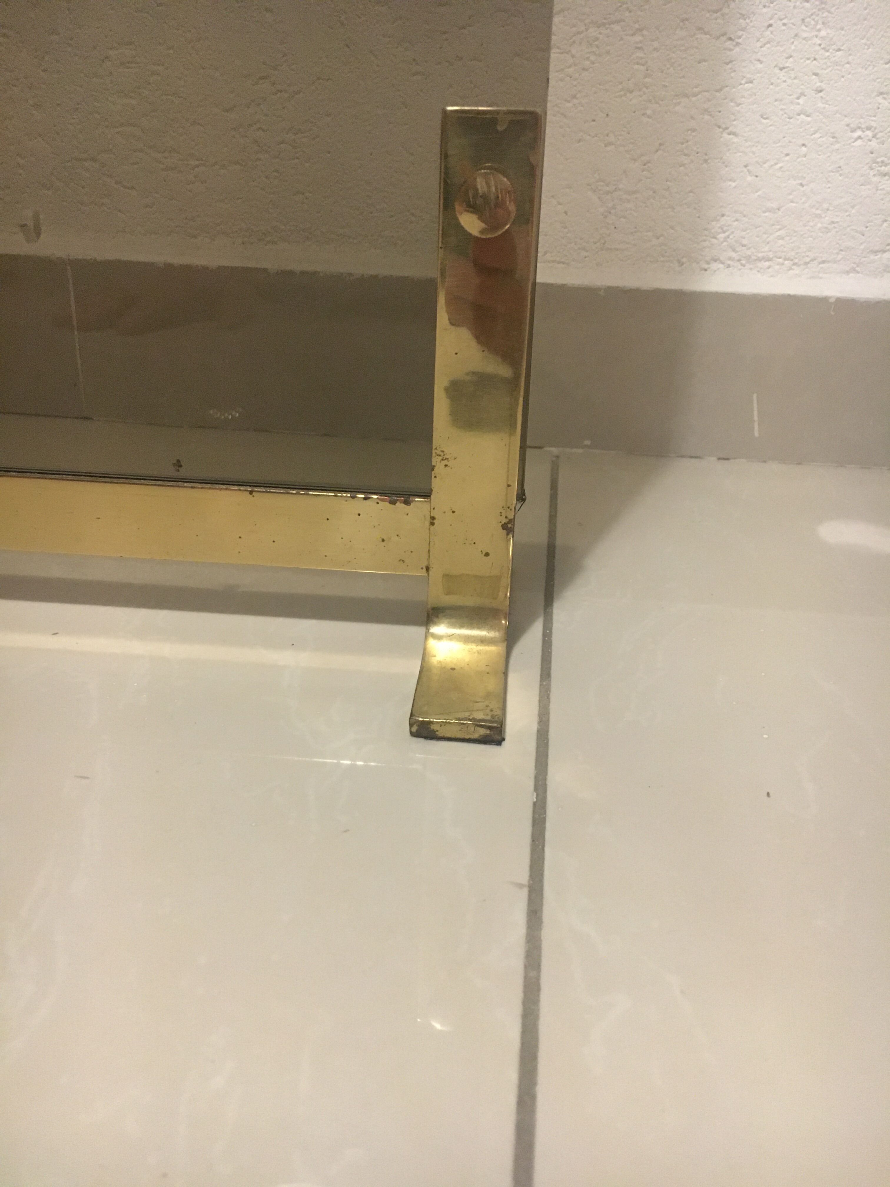 Fireplace screen in smoked glass and brass
