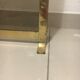 Fireplace screen in smoked glass and brass