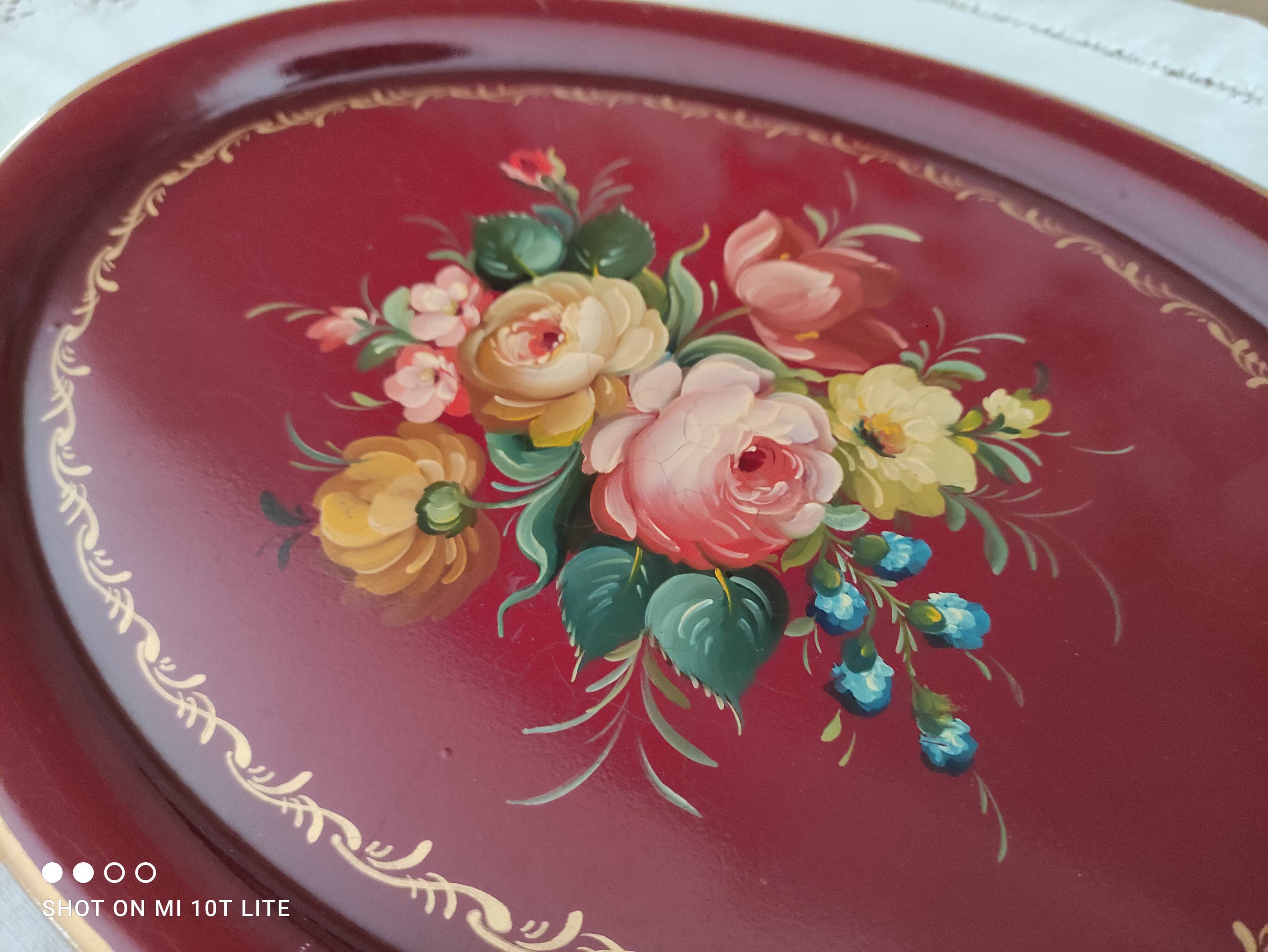 Russian plate in painted sheet metal burgundy old pink decoration and golden frieze